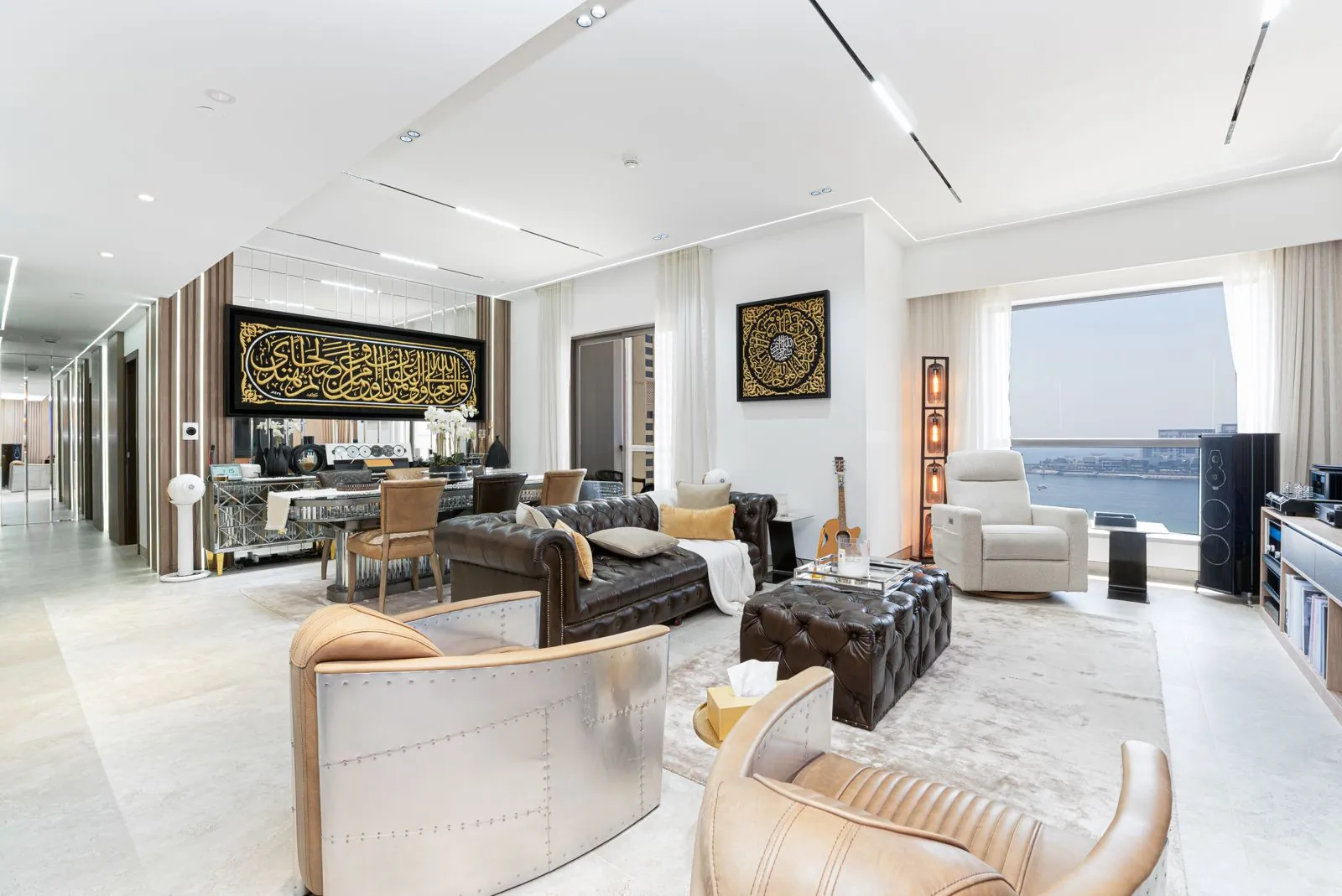 Completed living room with bespoke media wall and open kitchen