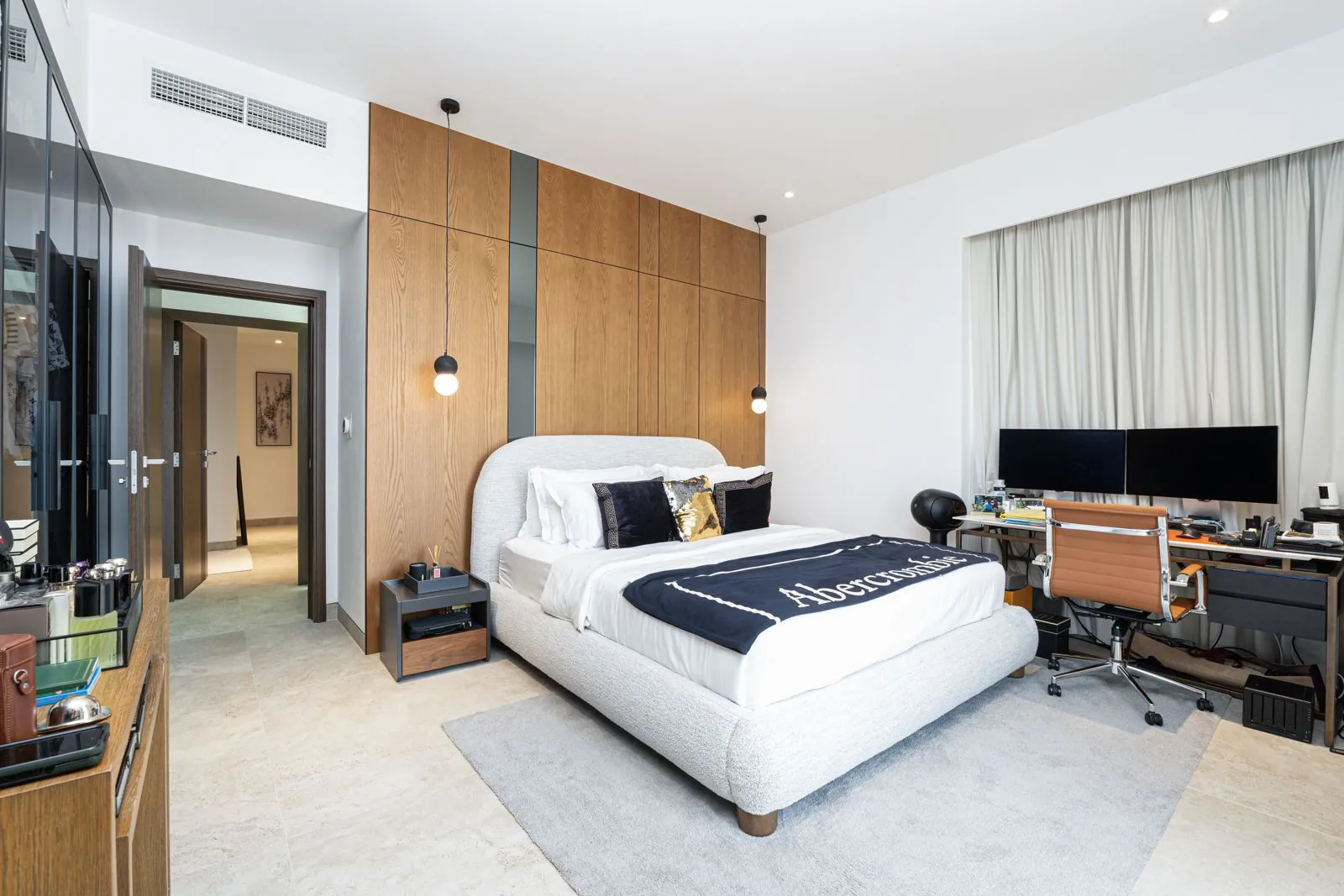 Completed dressing area with smoked-glass wardrobes