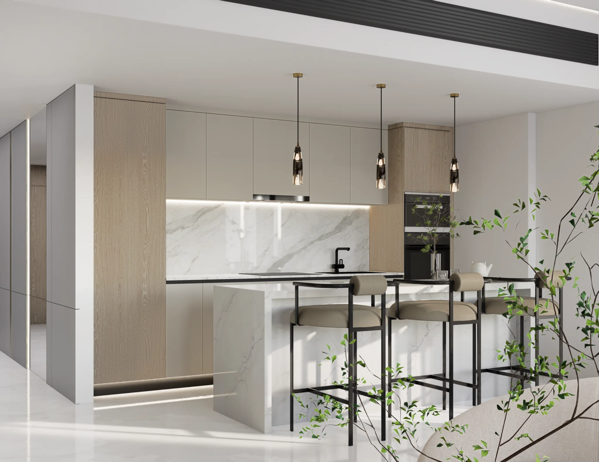 Angled view of the open-plan kitchen and breakfast bar
